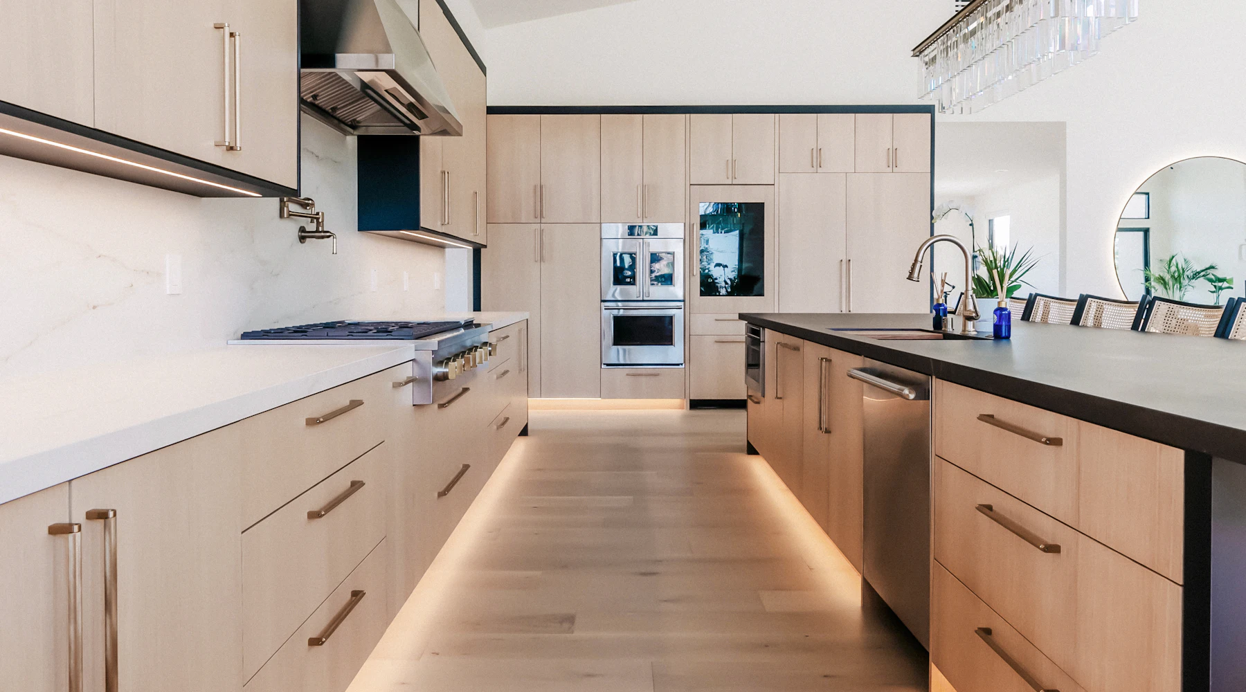 Kitchen with new light wood cabinets and an island