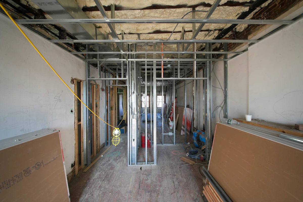 New drywall panels going up on framing