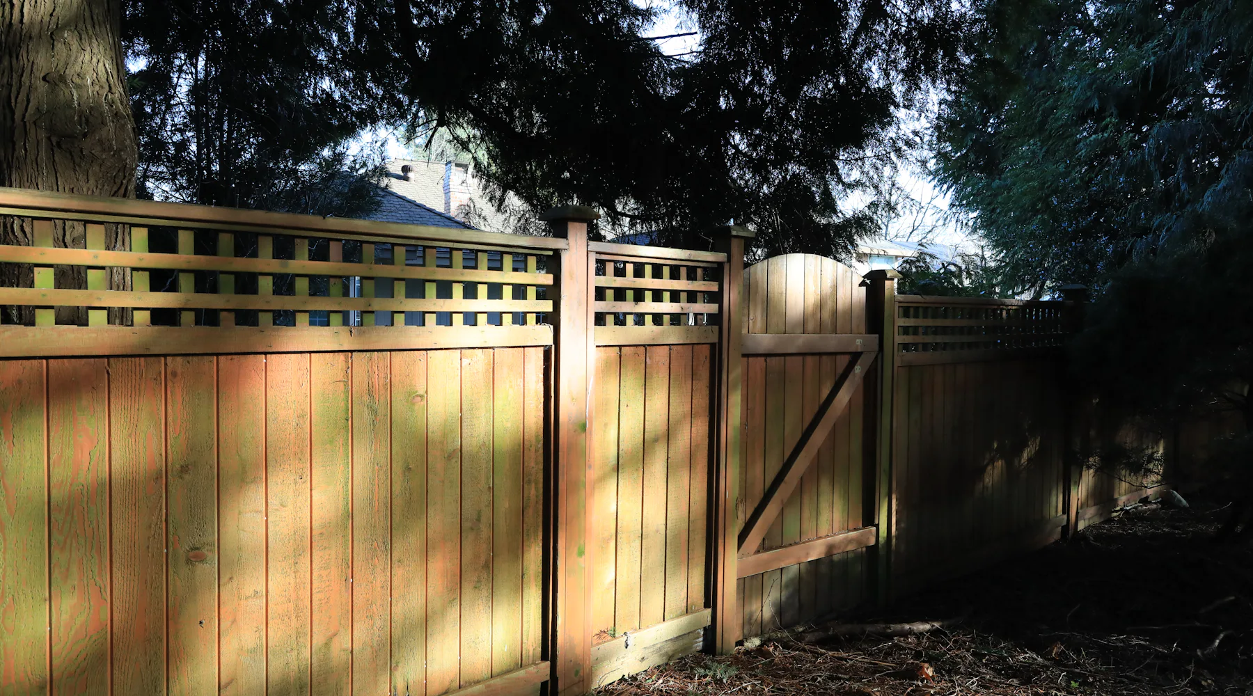 Wood fence and gate in the sun