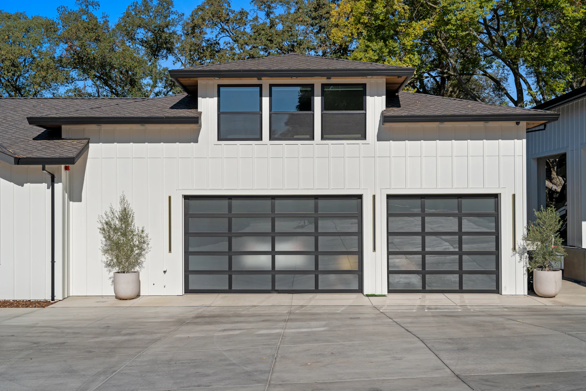 Modern garage doors on a white home