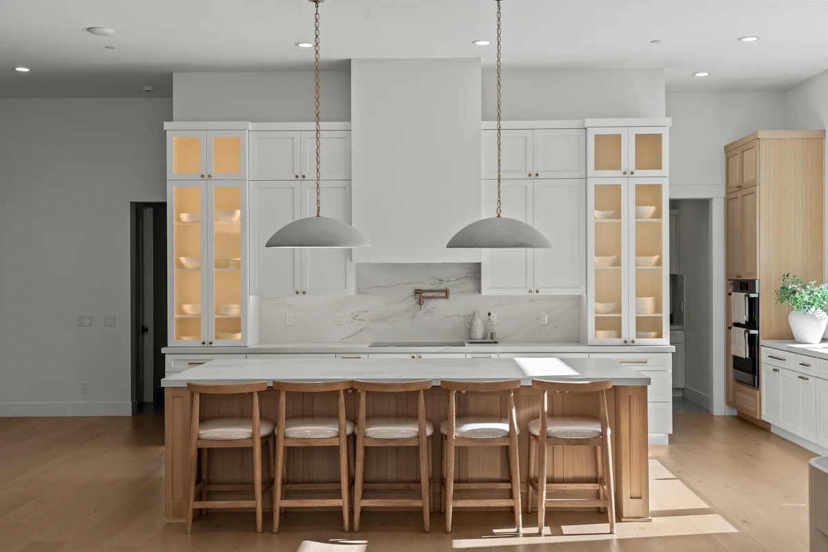 Kitchen with new cabinets, island and bar stools