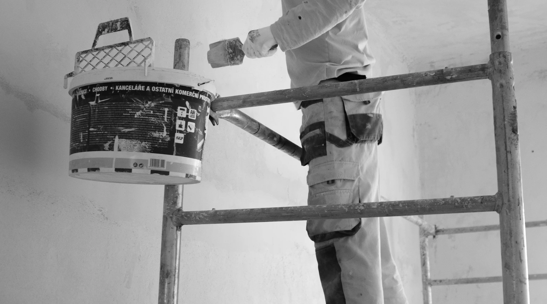 Painter rolling a wall