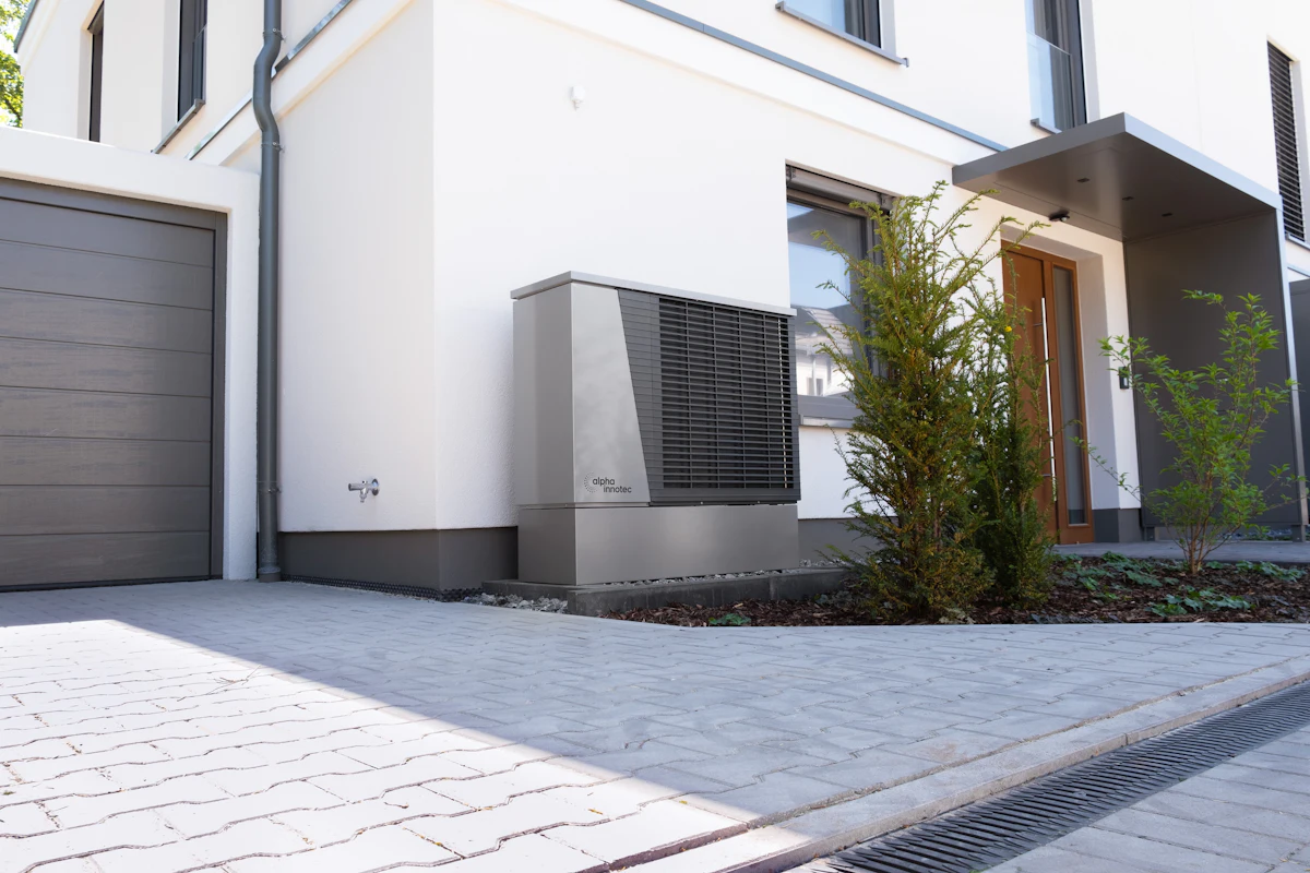 Heat-pump unit outside a modern home